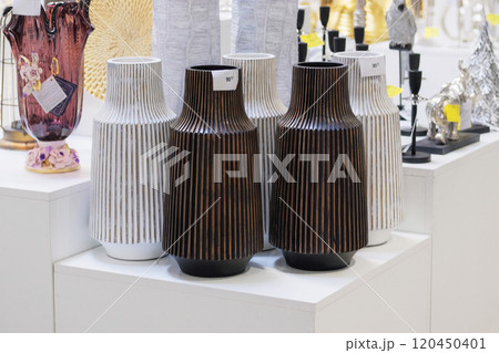Dark and white vases are sold in shop. Jars for bouquets of flowers. Sale of items for decorating premises. 120450401