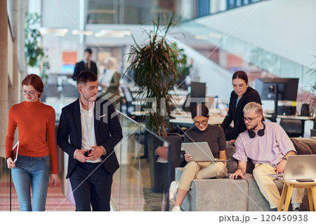 In a modern startup office, a diverse group of young professionals collaboratively tackles various business problems and challenges, surrounded by their engaged colleagues, fostering innovation and 120450938