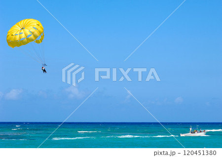 Parasailing over the caribbean sea. 120451380