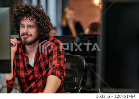 Focused Programmer With Afro Hairstyle in Plaid Shirt Working on Computer in Office Environment 120451464