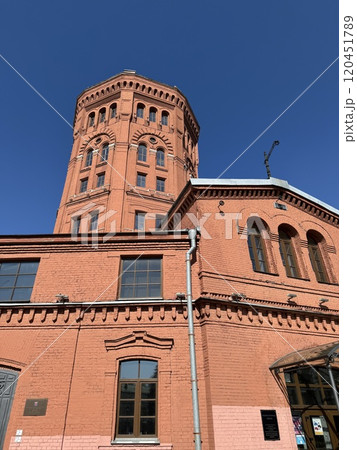 Historic Red Brick Water Tower Against Clear Blue Sky Historic Red Brick Water Tower Against Clear Blue Sky 120451789