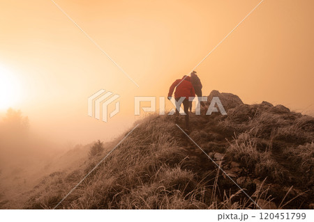 trail running couple man and woman running on a mountain path trail running couple man and woman running on a mountain path 120451799