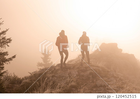 trail running couple man and woman running on a mountain path trail running couple man and woman running on a mountain path 120452515