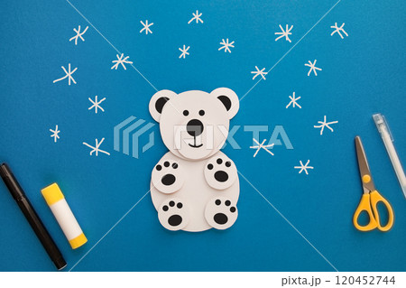 Crafts for children. Winter decoration from paper Polar Bear. Children's art project. DIY concept. Step by step. Step 4 Crafts for children. Winter decoration from paper Polar Bear. Children's art project. DIY concept. Step by step. Step 4 120452744