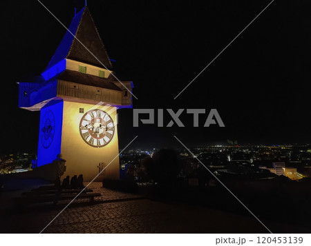 The famous Clock Tower (Grazer Uhrturm) on Shlossberg hill, Graz, Styria region, Austria, by night The famous Clock Tower (Grazer Uhrturm) on Shlossberg hill, Graz, Styria region, Austria, by night 120453139