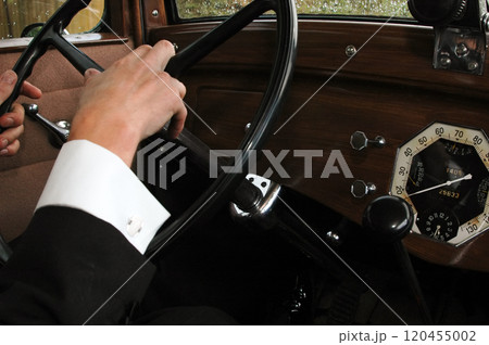 Driving an old car 120455002