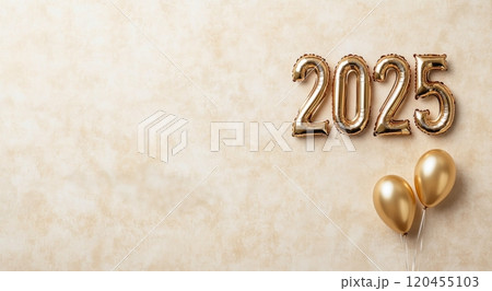Festive celebration setup featuring gold balloons and 2025 decor for New Year festivities 120455103