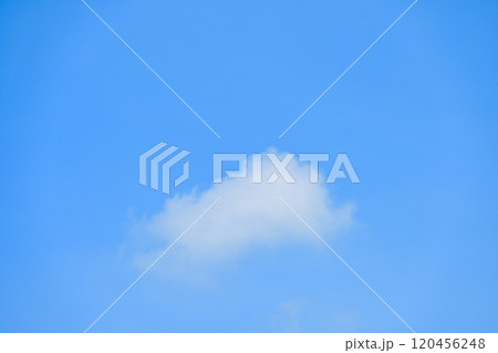 beautiful blue sky and white fluffy single cloud with sunrise in the morning, natural background 120456248