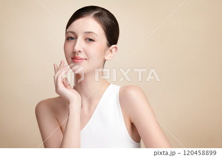 Beautiful young asian woman with clean fresh skin on beige background, Face care, Facial treatment, Cosmetology, beauty and spa, Asian women portrait. Beautiful young asian woman with clean fresh skin on beige background, Face care, Facial treatment, Cosmetology, beauty and spa, Asian women portrait. 120458899