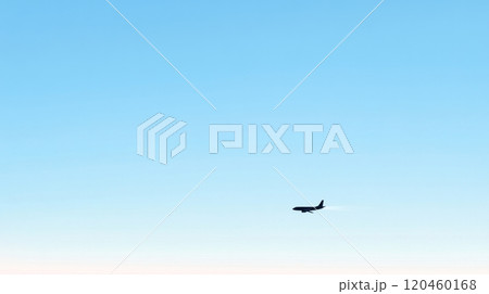 Airplane silhouette against clear blue sky, minimalistic scenery. Adventure and travel concept 120460168