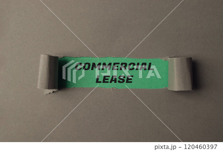 A torn piece of paper with the word commercial lease written on it A torn piece of paper with the word commercial lease written on it 120460397