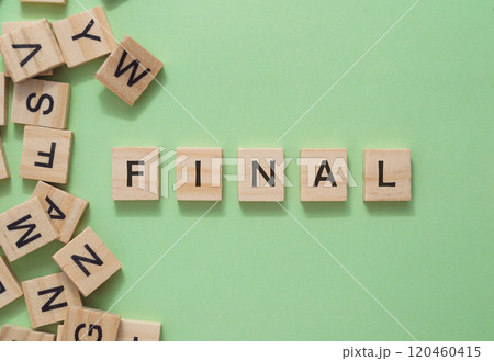 A pile of wooden blocks with the word final written on them A pile of wooden blocks with the word final written on them 120460415