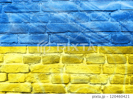 A blue and yellow flag is painted on a brick wall A blue and yellow flag is painted on a brick wall 120460421