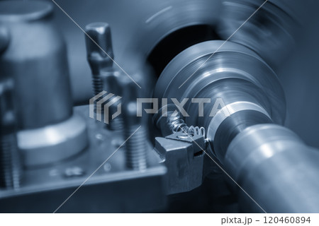 The turning machine operation with continue chip from turning process. The turning machine operation with continue chip from turning process. 120460894