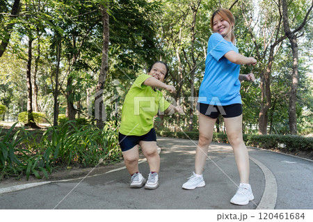 Young Women with Physical Differences Enjoying Outdoor Exercise Together in a Park Setting Young Women with Physical Differences Enjoying Outdoor Exercise Together in a Park Setting 120461684