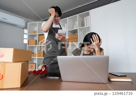 Stressed Couple Analyzing Stock Market Data Online at Home with Laptop and Smartphone Stressed Couple Analyzing Stock Market Data Online at Home with Laptop and Smartphone 120461710