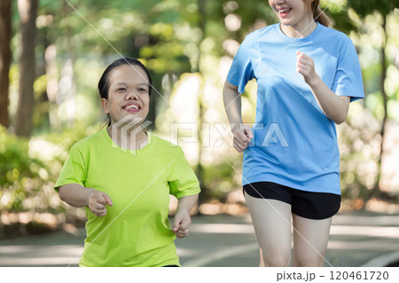 Young Woman with Physical Differences Exercising with Friend in Park, Embracing Fitness and Friendship in an Inclusive Environment 120461720