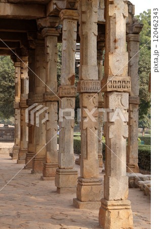 Columns with stone carving in courtyard of Quwwat-Ul-Islam mosque, Qutub Minar complex, Delhi, India 120462343