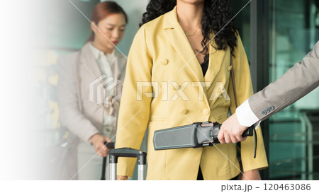 Airport security male check at gates with metal detector and scanner Airport security male check at gates with metal detector and scanner 120463086