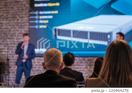 Business conference presentation with speaker and audience engaged 120464276