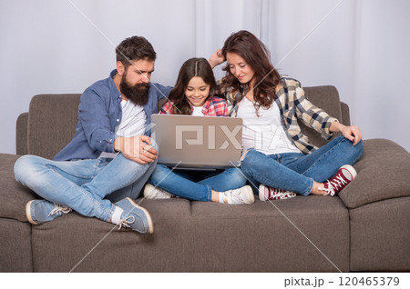 family blog. happy parents with kid girl study online. mom dad and daughter shopping 120465379