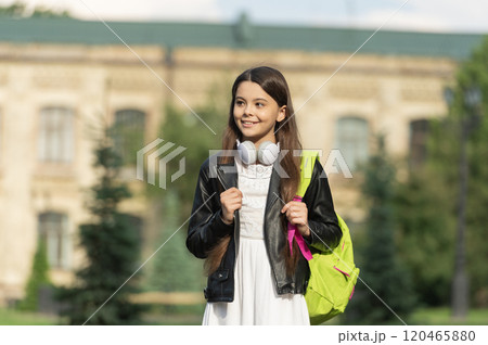 Adolescence lifestyle. Teen girl school student outdoor. Teenery lifestyle. Student life. Listen music in headphones. Teen girl generation. Lifestyle and education. Back to school. School education 120465880