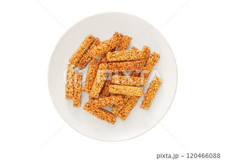 Gozinaki in a plate isolated on white background. Sweet granola in plate for holiday. Homemade seed candies. Top view. 120466088