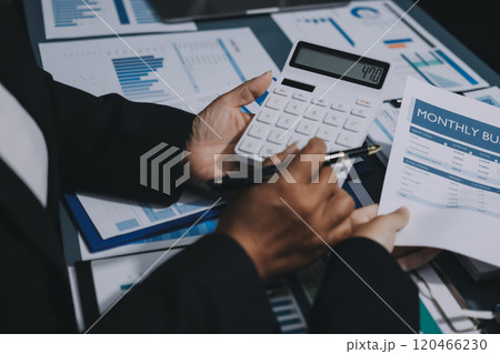 Fund managers team consultation and discuss about analysis Investment stock market at office 120466230