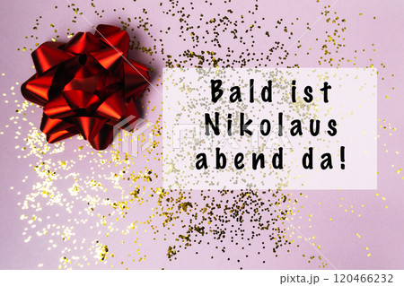 Red bow with gold glitter on a pink background 120466232