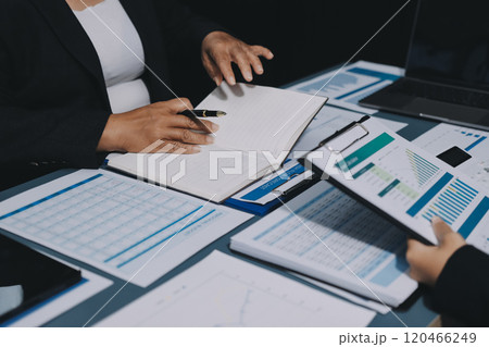 Fund managers team consultation and discuss about analysis Investment stock market at office 120466249
