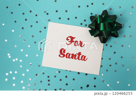 White card with red letters that says For Santa sits on a blue background wi White card with red letters that says For Santa sits on a blue background wi 120466255