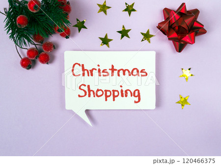 White sign with the words Christmas shopping written on it White sign with the words Christmas shopping written on it 120466375