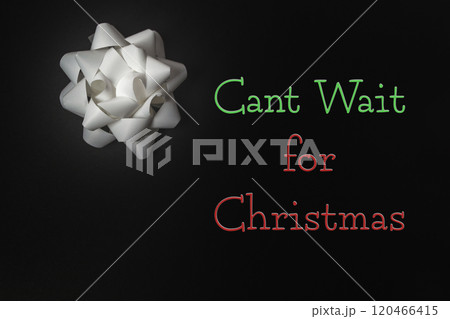 White bow with the words can't wait for christmas written in red and green 120466415