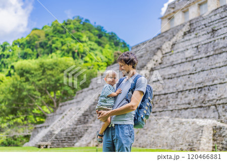 Father with his toddler son exploring the ancient pyramids of Palenque, Mexico, surrounded by dense jungle. Cultural heritage and adventure travel concept Father with his toddler son exploring the ancient pyramids of Palenque, Mexico, surrounded by dense jungle. Cultural heritage and adventure travel concept 120466881