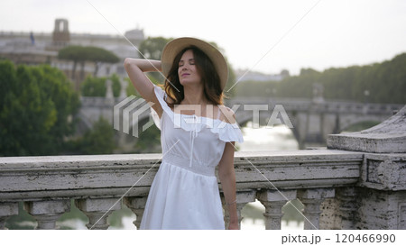 Elegant Woman Overlooking the Tiber River and Historic Roman Architecture Elegant Woman Overlooking the Tiber River and Historic Roman Architecture 120466990