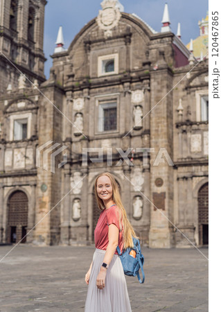 Female tourist in front of Catedral de Puebla, Mexico. Travel, cultural heritage, and historic architecture exploration concept Female tourist in front of Catedral de Puebla, Mexico. Travel, cultural heritage, and historic architecture exploration concept 120467865