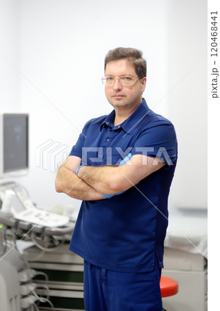 Portrait of oncologist mammologist doctor during appointment of patient. Doctor of ultrasound scanning during working in modern clinic. 120468441