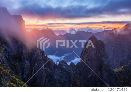 Mountains on sunset covered in fog and clouds. Madeira island, Portugal Mountains on sunset covered in fog and clouds. Madeira island, Portugal 120471433