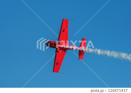 Stunt aerobatic plane performing stunts in air 120471437