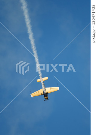 Stunt aerobatic plane performing stunts in air 120471438