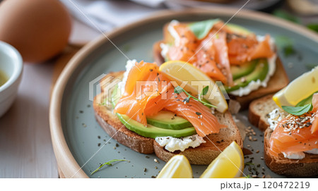 Avocado toast with smoked salmon for breakfast, homemade cuisine and traditional food, country life 120472219