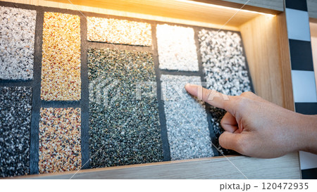 rchitect hand pointing at wash gravel texture on display shelf rchitect hand pointing at wash gravel texture on display shelf 120472935