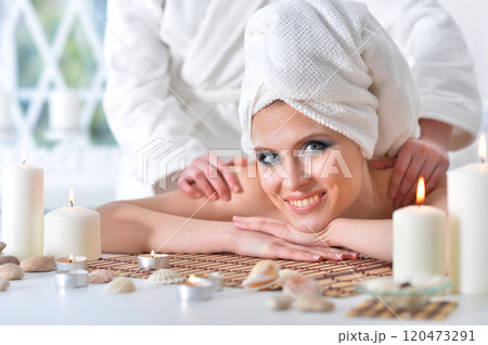 Beautiful woman in spa centar enjoying the massage. Beautiful woman in spa centar enjoying the massage. 120473291