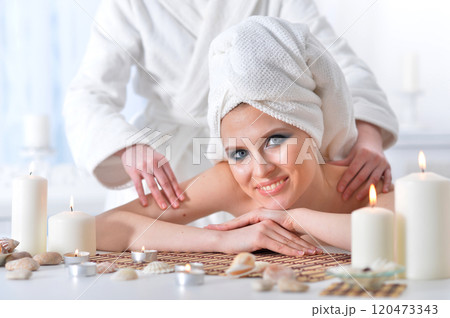 Beautiful woman in spa centar enjoying the massage. Beautiful woman in spa centar enjoying the massage. 120473343