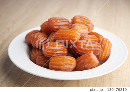 Traditional Turkish dessert tulumba on a plate Traditional Turkish dessert tulumba on a plate 120476210