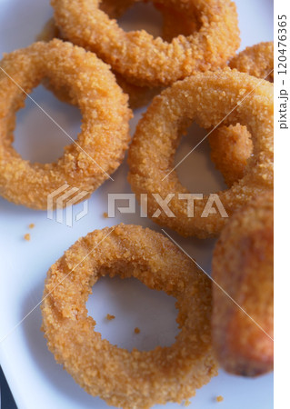 Deliciously Crispy Golden Fried Onion Rings Served Beautifully on a Plate for You Deliciously Crispy Golden Fried Onion Rings Served Beautifully on a Plate for You 120476365