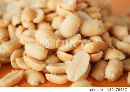 This is a CloseUp Image of Shelled Peanuts on a Beautifully Designed Wooden Surface This is a CloseUp Image of Shelled Peanuts on a Beautifully Designed Wooden Surface 120476487