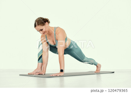 Fitness Trainer in Lunge Stretch Pose. 120479365