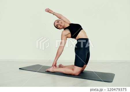Side Stretch Yoga Pose on the flor Side Stretch Yoga Pose on the flor 120479375