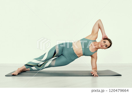 Side Plank with Hand Behind Head. Side Plank with Hand Behind Head. 120479664